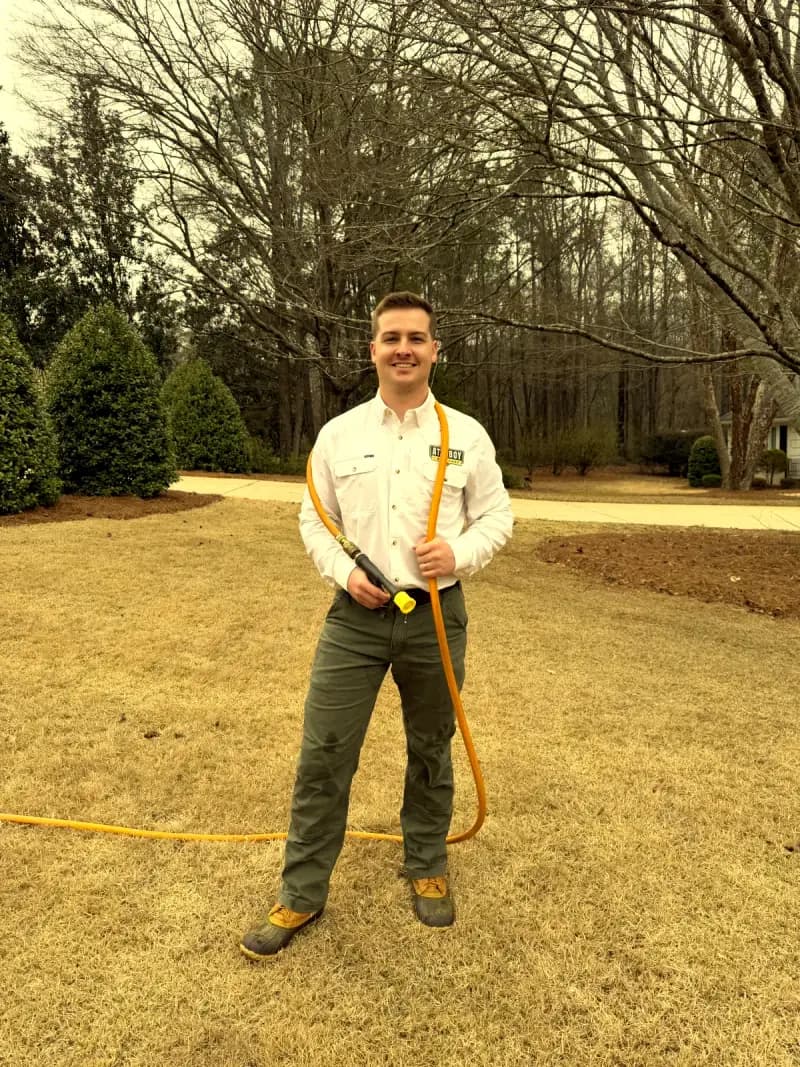 Attaboy Lawn Care owner ready to treat a lawn in Middle Georgia