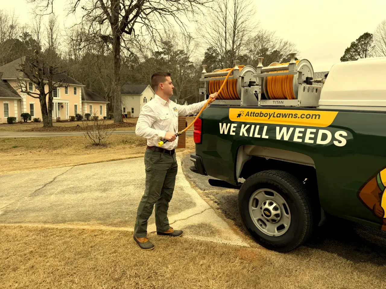 Attaboy Lawn Care service truck equipped for core aeration service